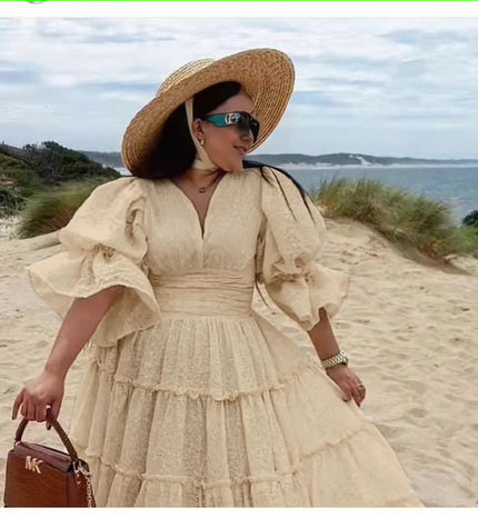 Beige tiered midi dress with puff sleeves and V-neck