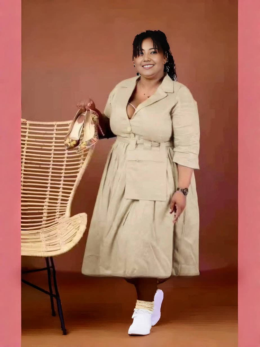 knee-length dress with a collar, waist belt, button details, and pockets