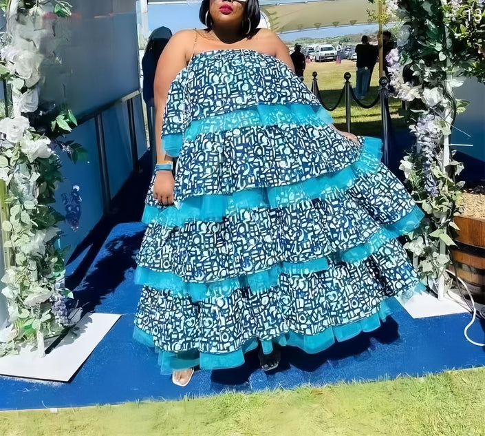 Layered maxi dress with blue-and-white geometric print and tiered ruffles