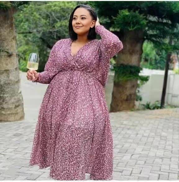 Plus size midi dress in light-pink with V-neck, cinched waist, long sleeves, patterned fabric