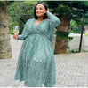 Plus size midi dress in light green with V-neck, cinched waist, long sleeves, patterned fabric