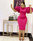 Pink bodycon midi dress with dramatic puff sleeves and fitted waist