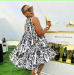 Sleeveless flared dress with black-and-white animal print, wide skirt