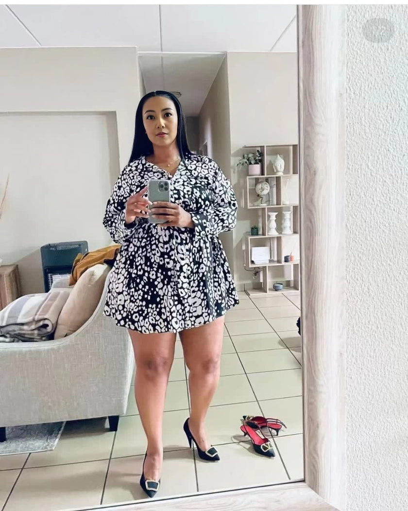 Modern Printed Mini Dress with Long Sleeves and V-Neck Design Featuring Waist Tie Detail