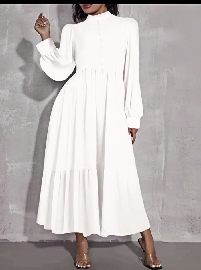 White midi dress with puff sleeves, button front, and tiered skirt