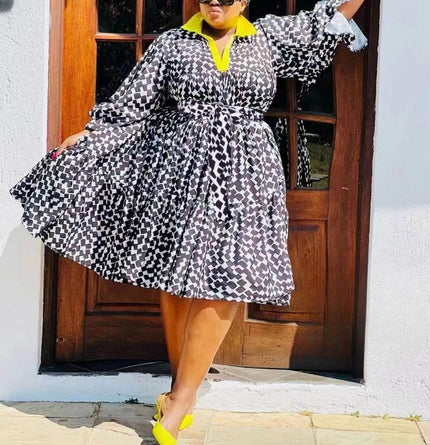 Plus size printed midi dress with black-and-white geometric pattern, cinched waist and collar