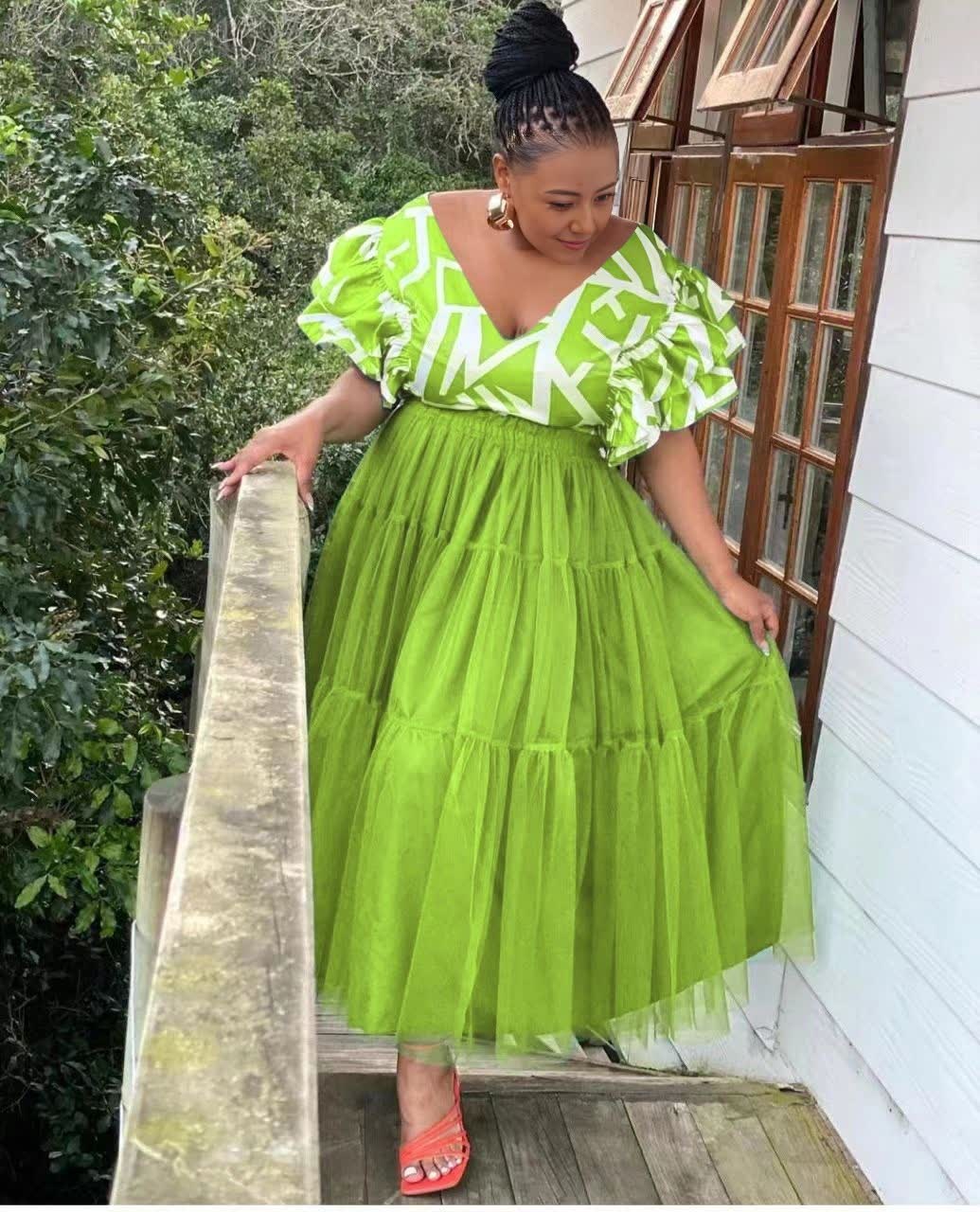 Lime-green tiered tulle maxi dress with puff sleeves and white patterned V-neck trim
