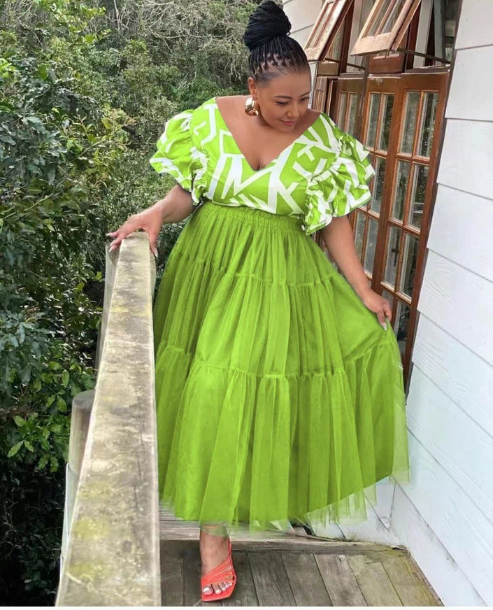 Lime-green tiered tulle maxi dress with puff sleeves and white patterned V-neck trim