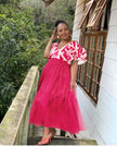 Deep-pink tiered tulle maxi dress with puff sleeves and white patterned V-neck trim