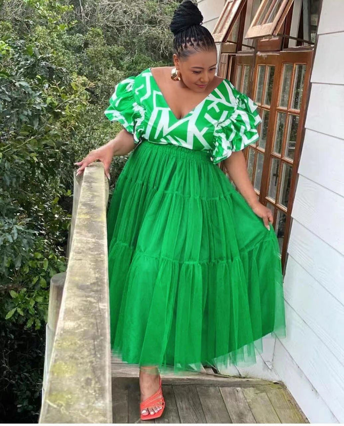 Bright green tiered tulle maxi dress with puff sleeves, V-neck patterned trim