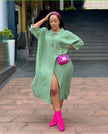 Light green oversized midi shirt dress with pointed collar, button front, side slit.