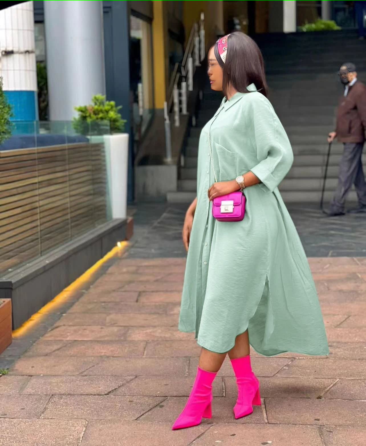 Mint green oversized midi shirt dress with pointed collar, button front, long sleeves, slit.