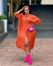 Orange-red oversized midi shirt dress with pointed collar, button front, side slit.
