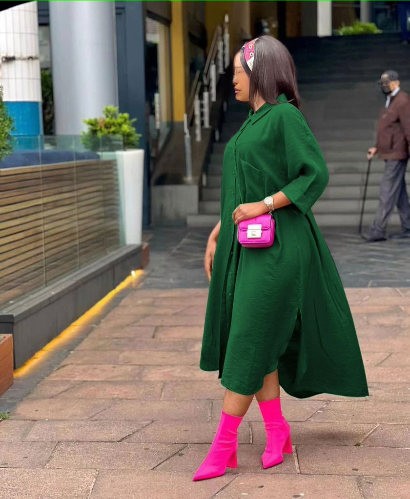 Dark green oversized midi shirt dress with pointed collar, button front, side slit.