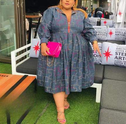 Blue patterned midi dress with puff sleeves and half-zip front, gathered skirt