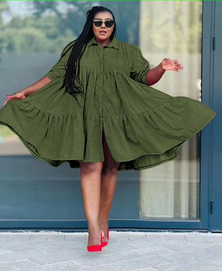 Dark green ruffle-hem shirt dress with button front and tiered skirt, long sleeves