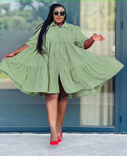 Light green ruffle-hem shirt dress with button front and tiered skirt, long sleeves