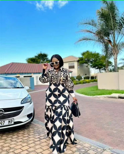Black-and-white geometric maxi dress with long sleeves and wavy hem