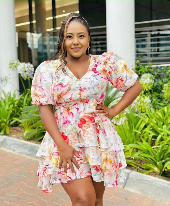 Light floral ruffle mini dress with puff sleeves and tiered skirt