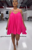 Deep-pink sleeveless flared dress with spaghetti straps, V-neck bodice, pleated swing skirt
