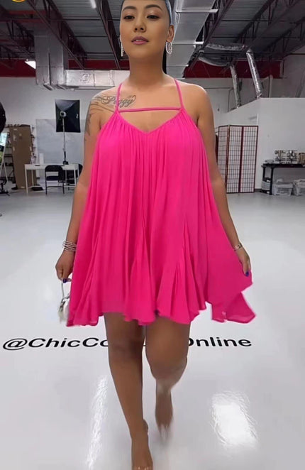 Deep-pink sleeveless flared dress with spaghetti straps, V-neck bodice, pleated swing skirt