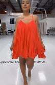 Orange-red sleeveless flared dress with spaghetti straps and V-neck, pleated swing skirt