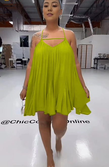 Green sleeveless flared dress, spaghetti straps, V-neck bodice, gathered pleated skirt