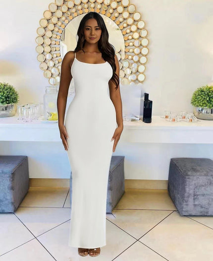 White sleeveless maxi dress with straight neckline, fitted column silhouette.