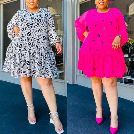 Printed plus size mini dress with puff sleeves and tiered skirt, number motifs, monochrome and pink.