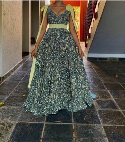 Plus size sleeveless maxi dress with ruffled floral print and gathered skirt