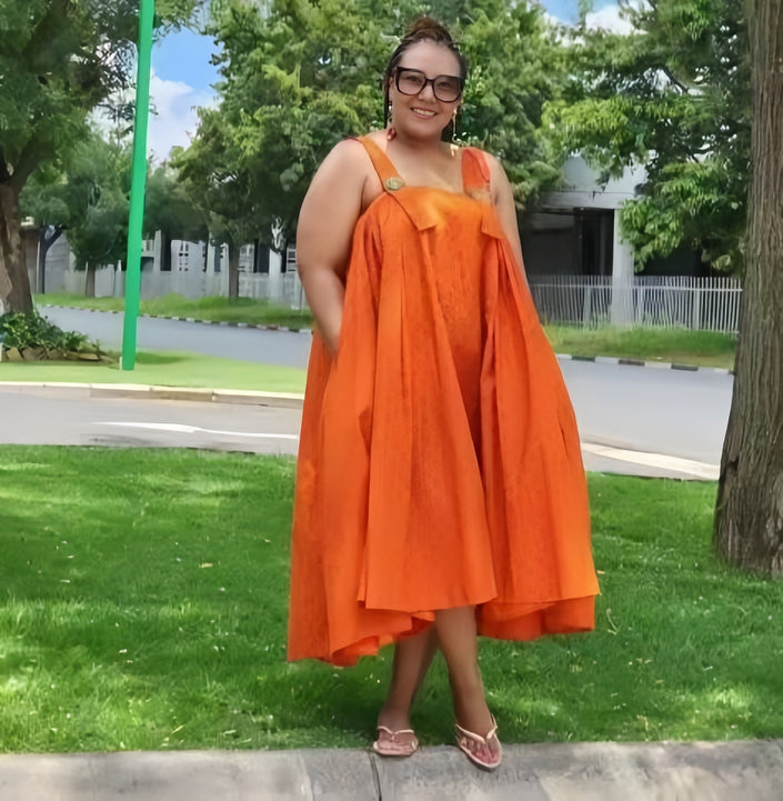 Orange off-shoulder ruffle hem dress with gathered bust and sleeveless bodice