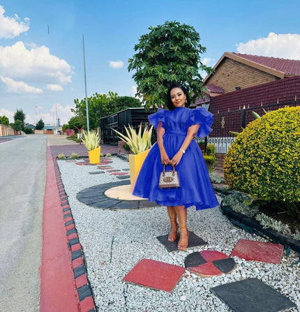 Royal-blue puff-sleeve midi dress with flared skirt and gathered waist