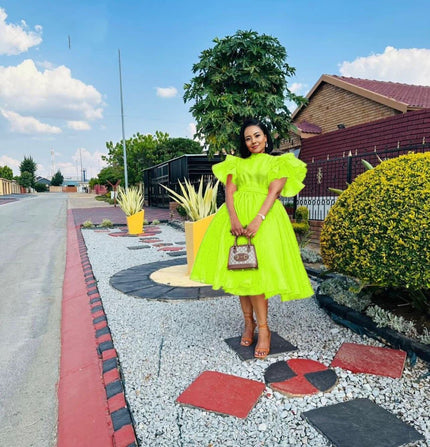 Neon-green puff-sleeve midi dress with flared skirt and gathered waist