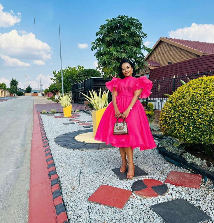 Hot-pink puff-sleeve midi dress with flared skirt and gathered waist
