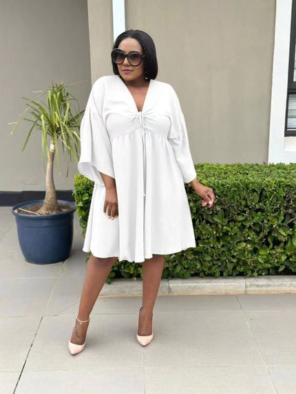 White flared sleeve dress with V-neck and adjustable drawstring front