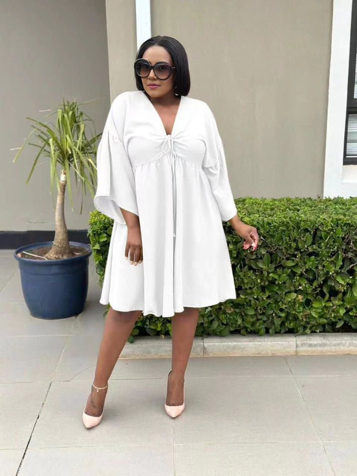 White flared sleeve dress with V-neck and adjustable drawstring front