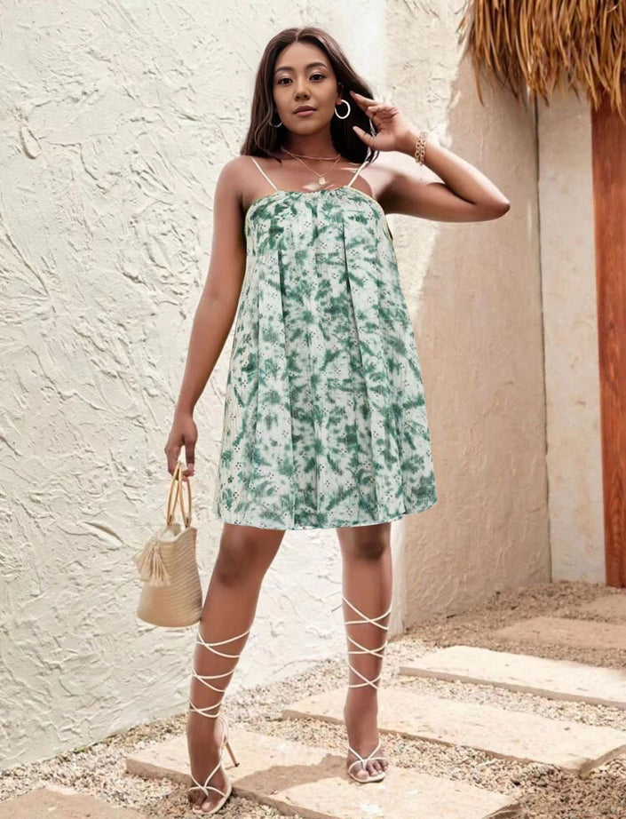 Green floral mini dress with thin straps and flared skirt