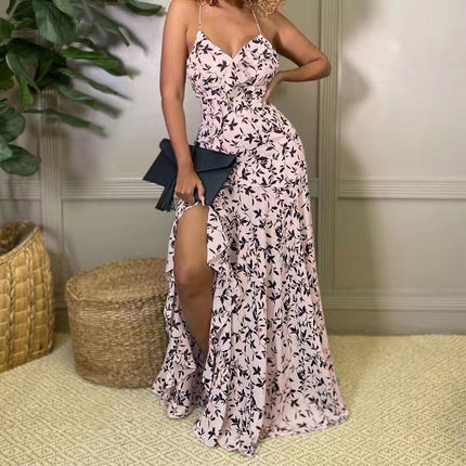 Light-pink maxi dress with spaghetti straps, floral print, and side slit