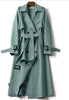 Light green double-breasted belted trench coat with inner panel detail