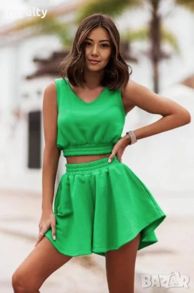 Green pleated skirt set with sleeveless cropped top, elastic waistband