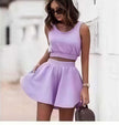Lavender pleated skirt set with sleeveless cropped top and gathered waist