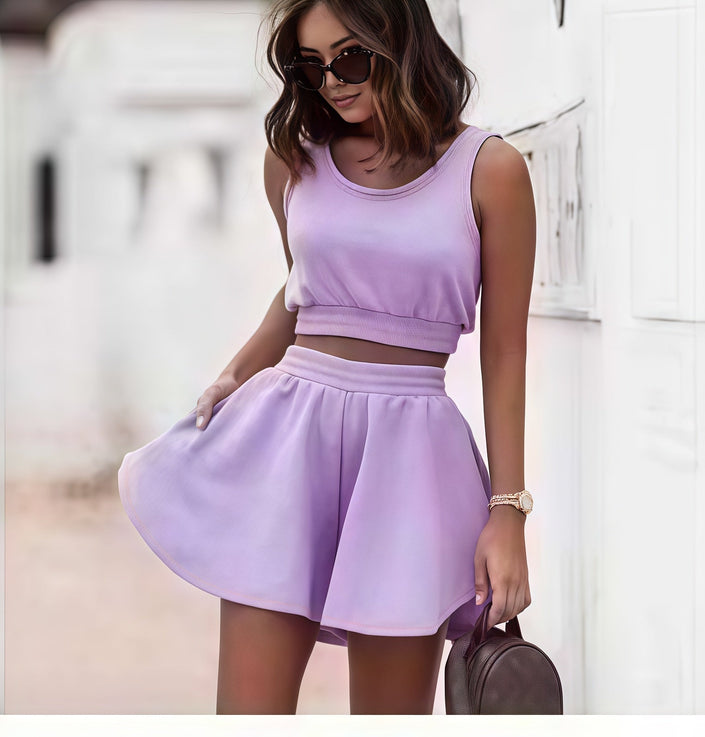 Lavender pleated skirt set with sleeveless cropped top and gathered waist