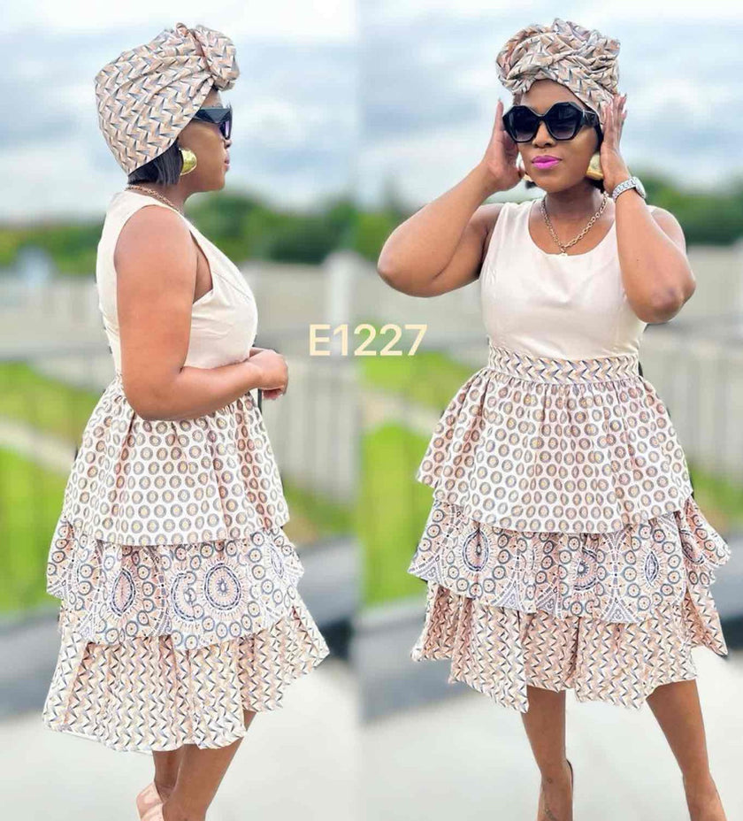 Ruffle mini dress with circular print layered skirt, sleeveless; cream and brown
