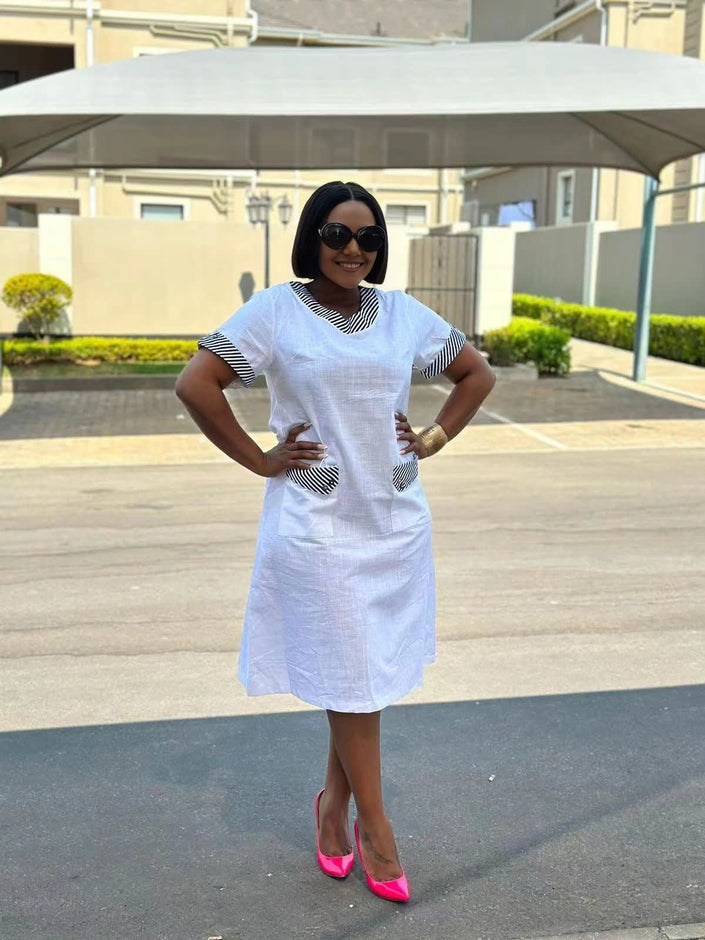 White midi dress with striped collar and side pockets
