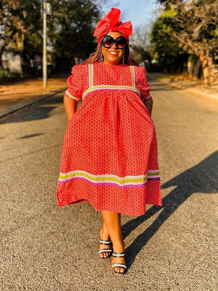 Red ethnic midi dress with striped yoke and hem, short sleeves, round neckline