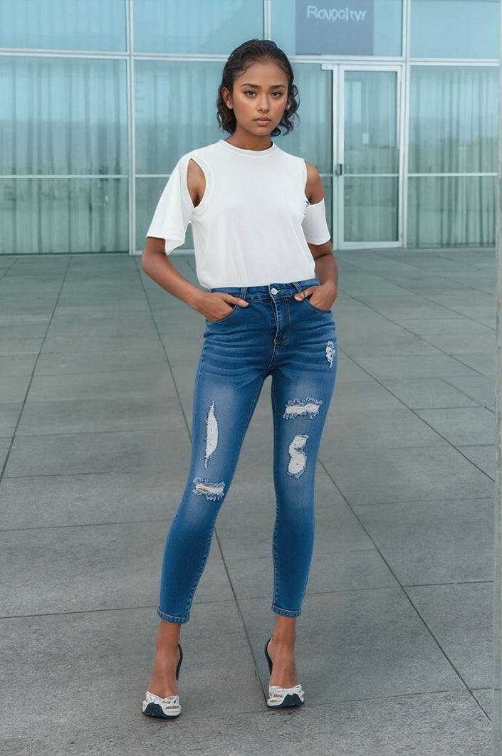 Blue distressed skinny jeans with ripped knees and slim fit