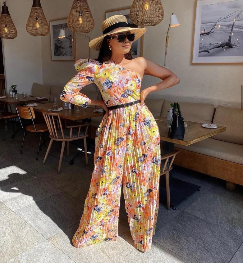 Floral one-shoulder ruffle jumpsuit with fitted bodice and flowing wide-leg pants