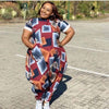 Geometric loose-fit jumpsuit in red, blue, and orange blocks with short sleeves