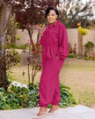 Rose-red collared zip-front jumpsuit with long sleeves, gathered waist, jogger cuffs.
