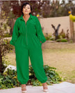 Green collared zip-front jumpsuit with long sleeves, gathered waist, cuffed tapered legs.